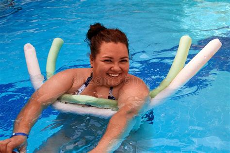Happy Girl Swims In A Pool Using A Foam Stick Stock Photo Image Of Pool Healthy