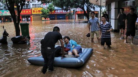 China Rains Thousands Stranded After Record Downpour Bbc News