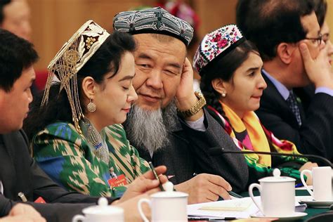 china bans abnormal beards and burqas in muslim majority region