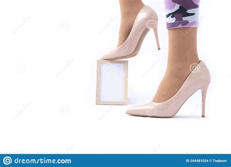 slender female legs elegant patent beige high heels leggings in camouflage the girl is
