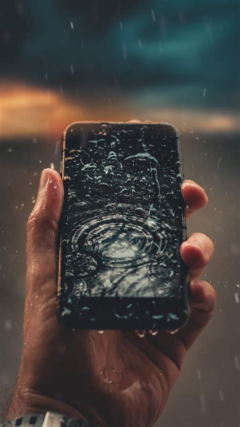2160x3840 Raindrops On Phone Display In Hand Outdoors 4k