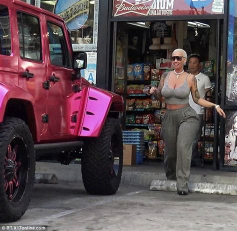 Amber Rose Stops Traffic In Booty Hugging Trousers While Hoppng Into