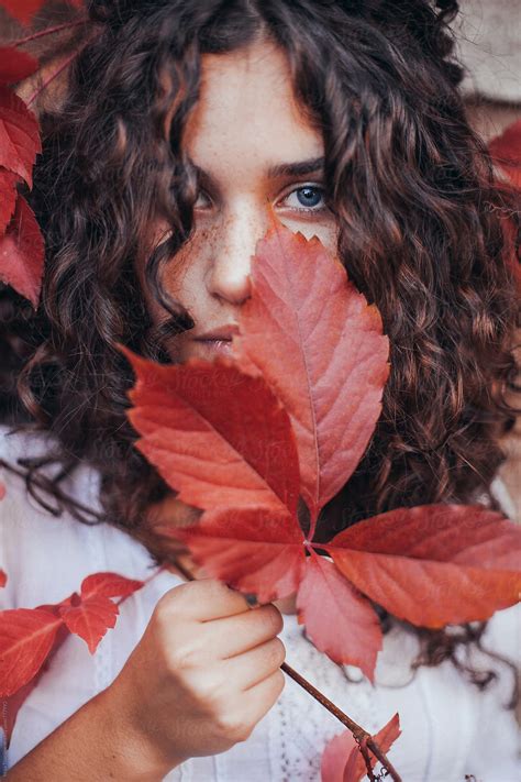 Beautiful Young Woman With Curly Hair Blue Eyes And Freckles Del Colaborador De Stocksy Maja