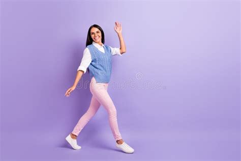 Full Length Body Size View Of Attractive Cheerful Friendly Girl Walking