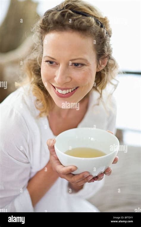 Middle Aged Woman Drinking Tea Stock Photo Alamy