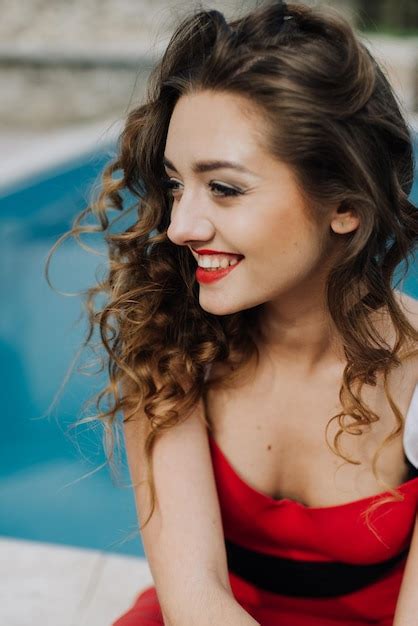 Premium Photo Happy Beautiful Woman In Red Dress On The Beach