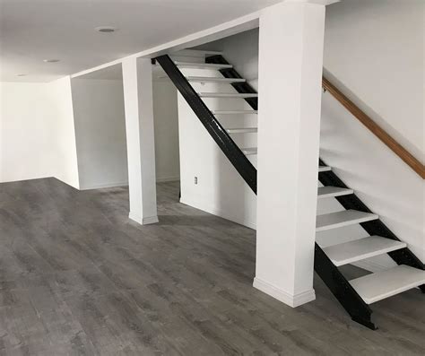 You'll need a contractor to do it. Basement Stair Stringers by Fast-Stairs.com