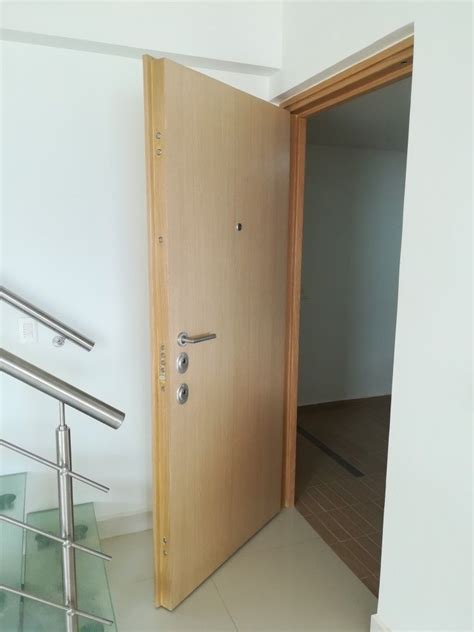 An Open Door Leading To A Room With Glass Railings On The Floor And Stairs