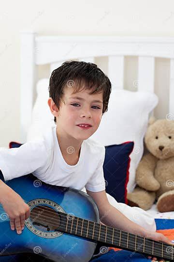 Portrait Of A Little Boy Playing Guitar Stock Image Image Of Little