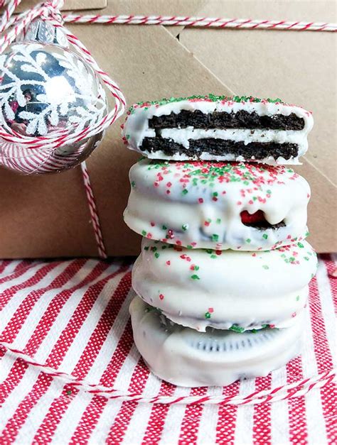 Find 50 christmas cookie recipes and ideas for holiday baking! Easy Chocolate Dipped Oreo Christmas Cookies - On The Go Bites