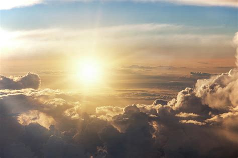 Rising Sun Over Clouds Photograph By Buena Vista Images Pixels