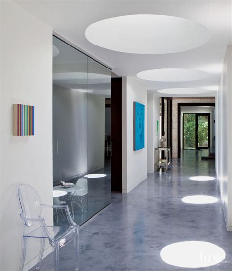 Modern White Central Hallway With Circular Skylights Luxe Interiors
