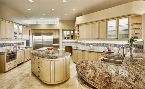 We ran the stone right up the wall for the full backsplash and used little curves in the design to accentuate the rich burgundy swirls in the pattern. Typhoon Bordeaux Granite Kitchen - Traditional - Kitchen ...