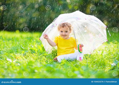 Baby Under Umbrella In Summer Rain Stock Photo Image Of Outside
