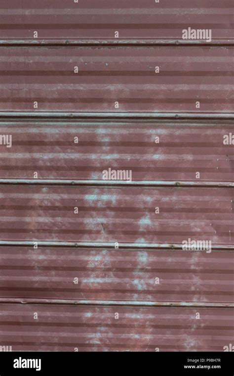 Faded Peeling Rusty Steel Sheets With Oxblood Red Paint Grunge