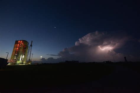 Lightning Strikes At Dawn Near Nasas Orion Test Vehicle During A
