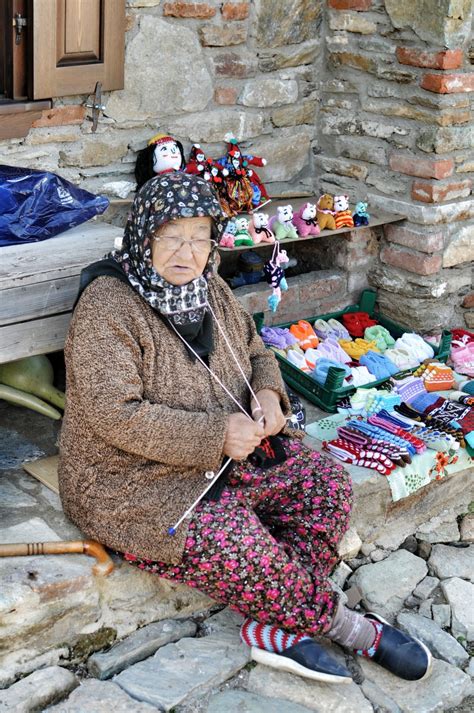 Pws Photos Worth Seeing — Old Lady Sitting And Knitting In Front Of