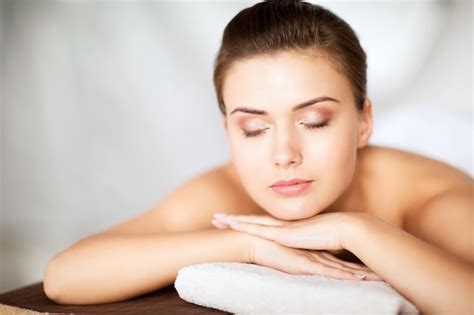 Premium Photo Beauty And Spa Concept Woman In Spa Salon Lying On The Massage Desk