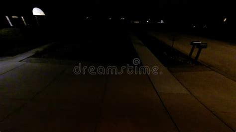 Aerial Night View Of Residential Suburban Neighborhood With Street