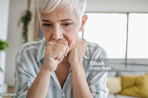 Close Up Of Senior Woman Coughing Stock Photo Download Image Now