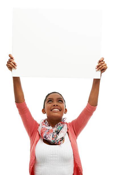 Woman Holding Up A Sign Stock Photos Pictures And Royalty Free Images