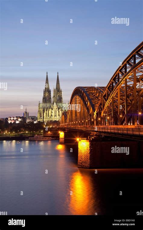 Cologne Cathedral With River Rhine And Hohenzollern Brucke Bridge