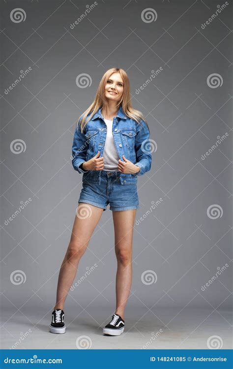 Beautiful Blonde Woman Dressed In A Denim Jacket And Shorts Stock Image Image Of Beautiful