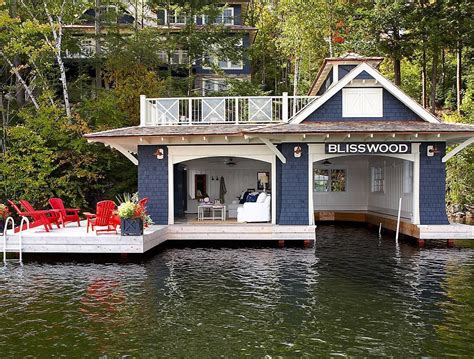 boat house with sitting room and deep blue wood paneling muskoka living interiors house boat