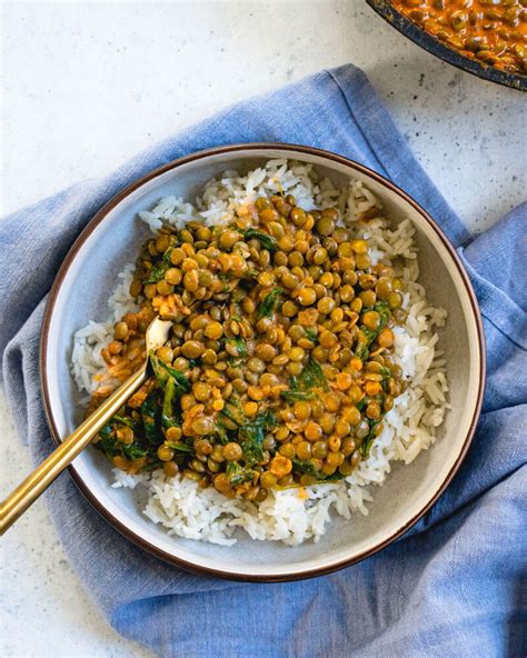 Simple, flavorful curried yellow lentils seasoned with fresh spices, garlic, ginger, and swimming in a curried coconut sauce. Quick Coconut Lentil Curry - A Couple Cooks