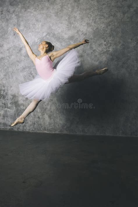 Pretty Young Ballerina Dancer Dancing Classical Ballet Against Rustic