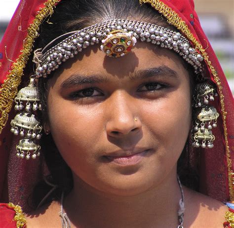 a girl dressed in traditional indian clothing and silver jewellery took this in jaipur