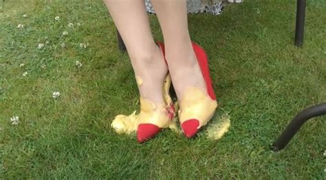 pretty girl s red suede heels smothered in gloopy smelly gunge elegant high heels red suede