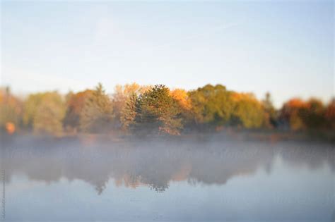 Fog In The Morning Over An Autumn Lake In Michigan By Stocksy