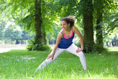 Young Woman Stretching Outdoors Stock Photo Image Of Clothes Outside