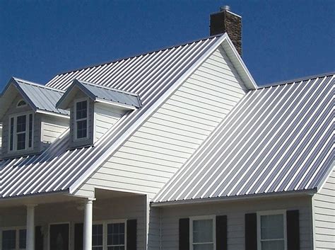 Metal roof tops asphalt for this homeowner. R-Panel (Ribbed) - Fiddlers Roofing