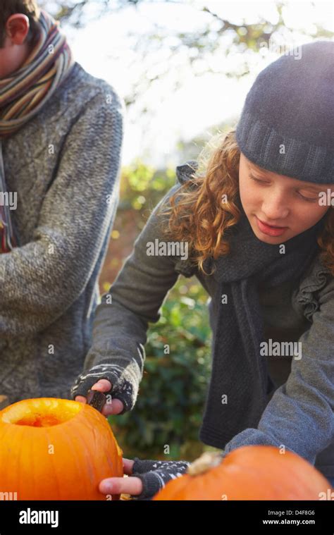 Children Carving Pumpkins Together Outdoors Stock Photo Alamy