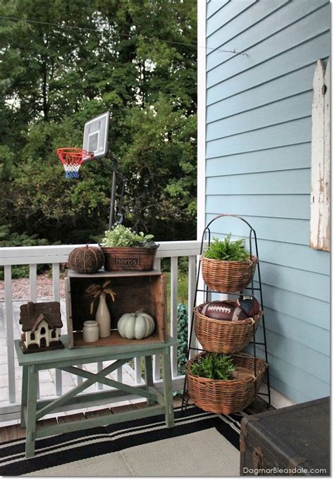 A Porch With A Basketball Hoop Basket And Planters On The Back Deck Area