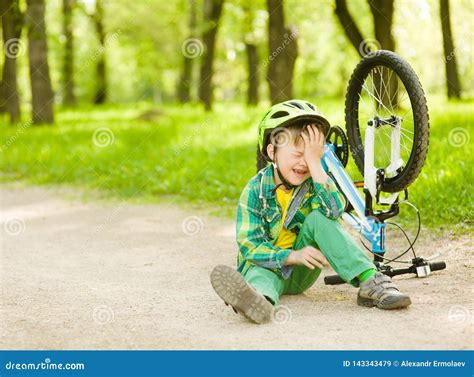 Boy Fell From The Bike In A Park Stock Image Image Of Little
