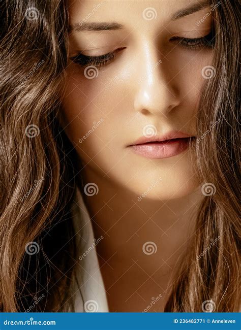 Beautiful Woman With Calm And Relaxed Face Expression Natural Look And Long Wavy Hairstyle