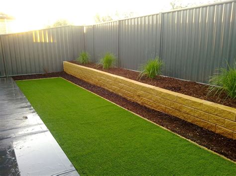 Retaining Wall With Garden Bed For Plants Landscaping Along Fence