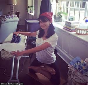 Hilaria Baldwin Holds An Umbrella Balancing In Yoga Pose Of The Day Daily Mail Online