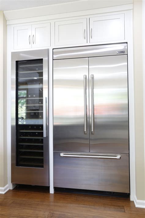 Jenn Air 42” Integrated Built In French Door Refrigerator Next To A
