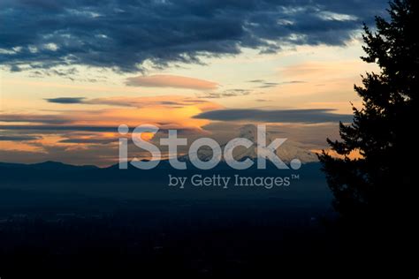 Lenticular Clouds Surround Mount Hood At Sunset Stock Photos