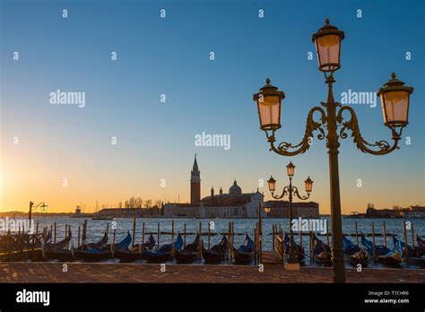 Venice Italy Seafront With Gondolas And Lanterns At Sunrise Stock Photo