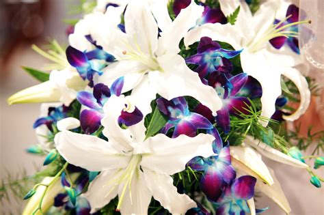 Use more ribbon to add a finishing touch and add your theme. My wedding bouquet was made with calla lillies and blue ...
