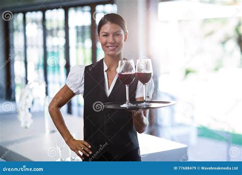 Smiling Waitress Holding A Tray With Glasses Of Red Wine Stock Image Image Of Person Cheerful