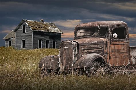 Old Vintage Pickup By An Abandoned Farm House On The Prairie Photograph
