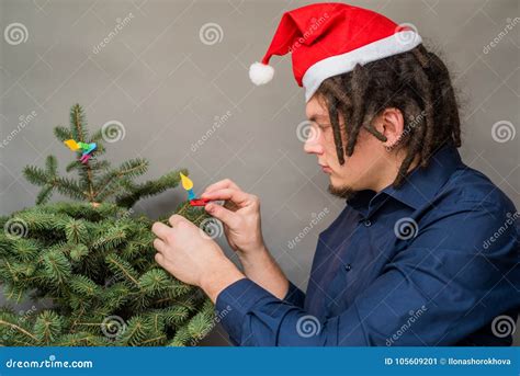 Caucasian Man With Dreadlocks Hairstyle And Santa Hat Haning