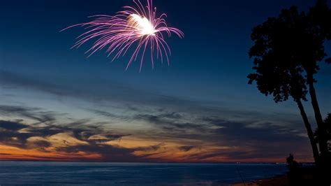 Fireworks On A Beach At Sunset Windows Spotlight Images