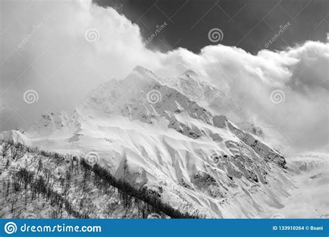 Snowy Mountain Peaks In Sunlight Clouds Stock Photo Image Of Nature